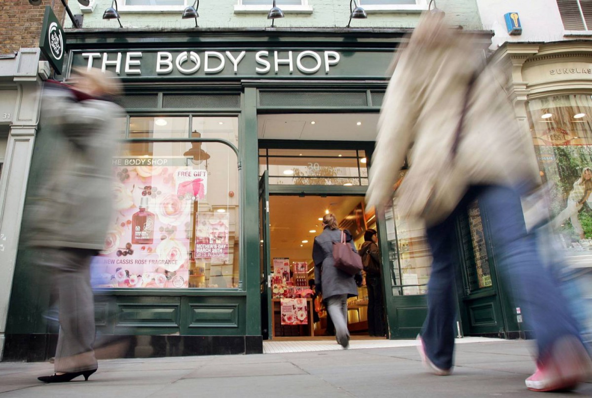 Shoppers walk into a Body Shop store in Covent Garden, central London, March 17, 2006.