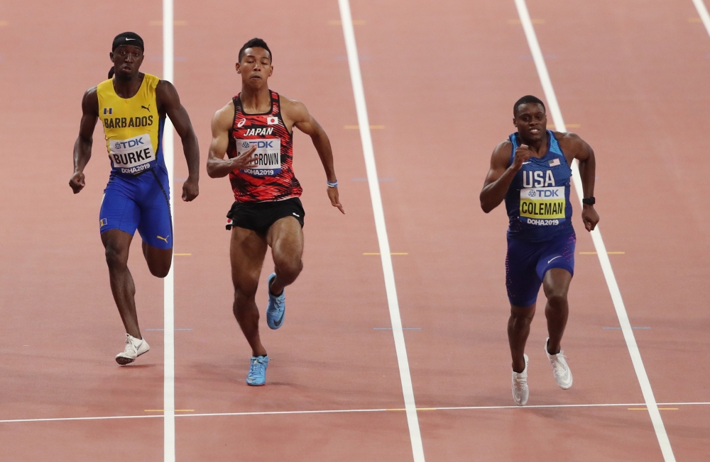 Christian Coleman of the US in action with Japan's Abdul Hakim Sani Brown and Barbados' Mario Burke Reuters/Ahmed Jadallah