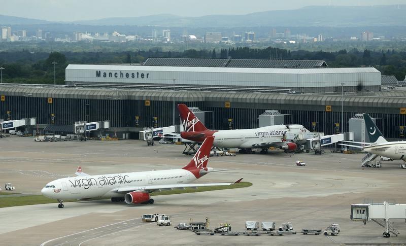 Virgin Atlantic aircraft taxi across the tarmac at Manchester Airport at Manchester Airport, northern England June 25, 2013. Reuters/Phil Noble
