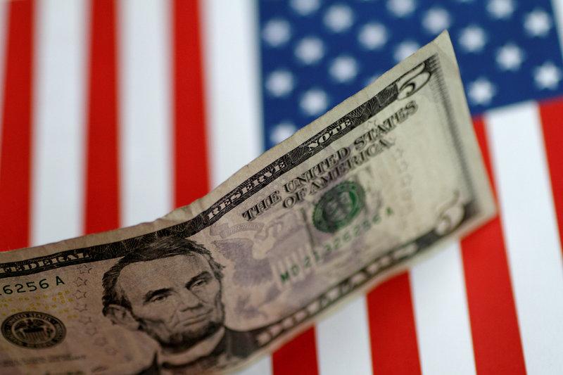 FILE PHOTO:  A US five dollar note is seen in this illustration photo, June 1, 2017. Reuters / Thomas White