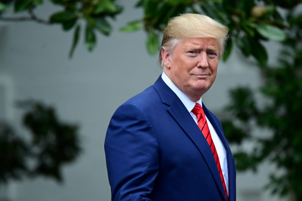 FILE PHOTO: US President Donald Trump arrives for a photo opportunity with sheriffs from across the country on the South Lawn of the White House in Washington, U.S., September 26, 2019. REUTERS/Erin Scott/File Photo