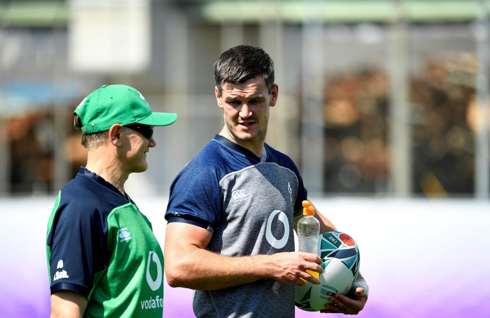 Ireland's head coach Joe Schmidt (L) speaks with Ireland's fly-half Jonathan Sexton at a training session at the Steelers Training Ground in Kobe on October 1, 2019, during the Japan 2019 Rugby World Cup. / AFP / Filippo Monteforte