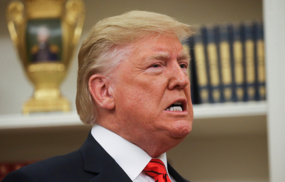 FILE PHOTO: U.S. President Donald Trump speaks during a ceremonial swearing-in for Labor Secretary Eugene Scalia at the White House in Washington, U.S., September 30, 2019. REUTERS/Leah Millis