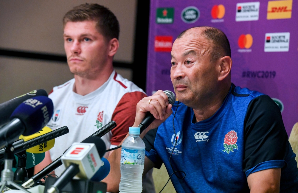 England's coach Eddie Jones (R) and fly-half Owen Farrell (L) answer questions from the media after the team announcement in Tokyo on October 3, 2019, two days ahead of England's Japan 2019 Rugby World Cup Pool D match against Argentina. / AFP / William W
