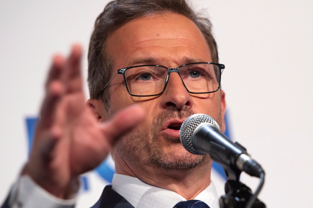 Leader of the Bloc Quebecois Yves-Francois Blanchet gestures as he addresses the press after the French debate for the 2019 federal election, the 