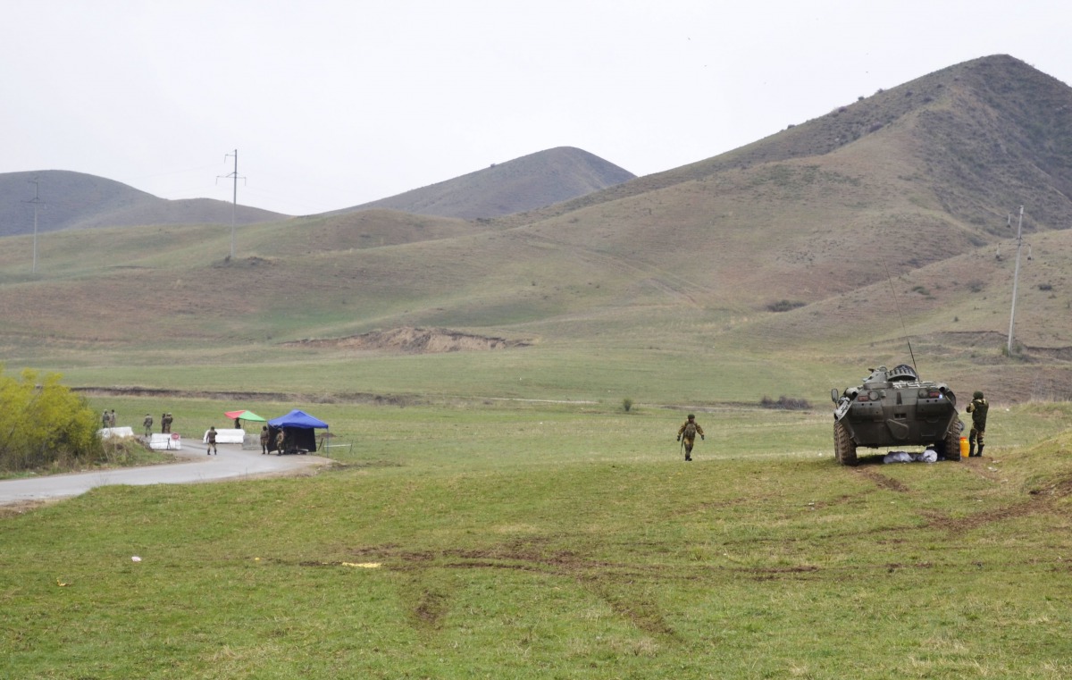 Kyrgyz and Uzbek troops are seen in a disputed area near the town of Kerben, Kyrgyzstan, March 25, 2016. Reuters / Hulkar Isamova