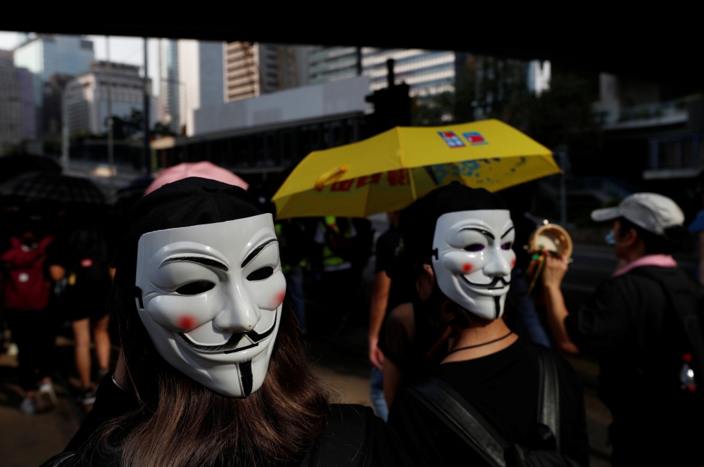 Anti-government protesters wearing masks attend a protest in central Hong Kong, China October 5, 2019. REUTERS/Jorge Silva