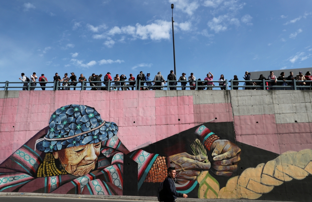 People wait as trucks block main roads during protests after Ecuador's President Lenin Moreno's government ended four-decade-old fuel subsidies, in Carapungo, near Quito, Ecuador, October 7, 2019. Reuters/Ivan Alvarado