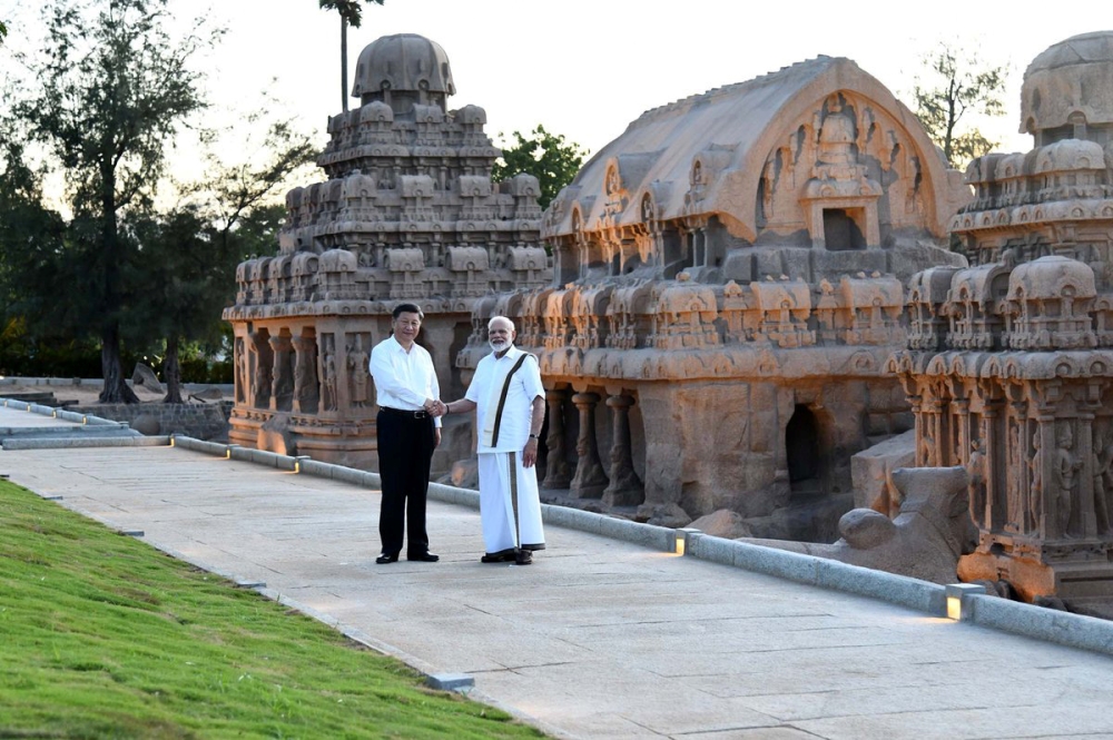 China's President Xi Jinping shakes hands with India's Prime Minister Narendra Modi during their visit to the Pancha Rathas complex in Mamallapuram on the outskirts of Chennai, India, October 11, 2019. (India's Press Information Bureau/Handout via REUTERS