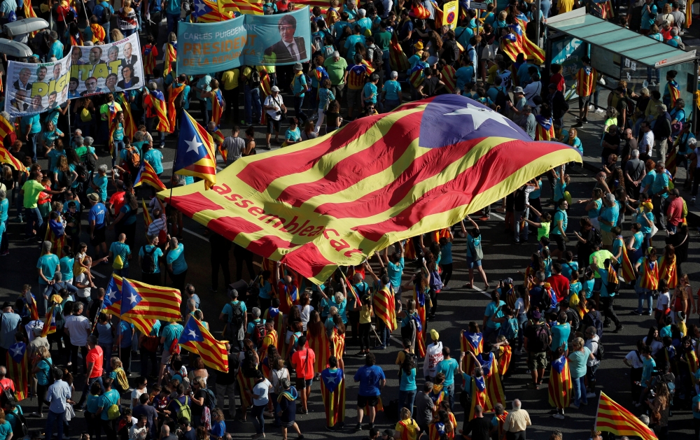 FILE PHOTO: People hold a giant 
