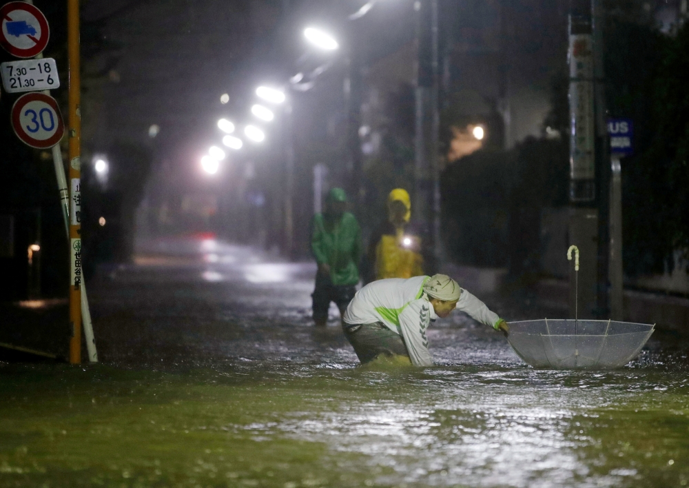 Roads are flooded due to heavy rains caused by Typhoon Hagibis at Setagaya ward in Tokyo, Japan, October 12, 2019.