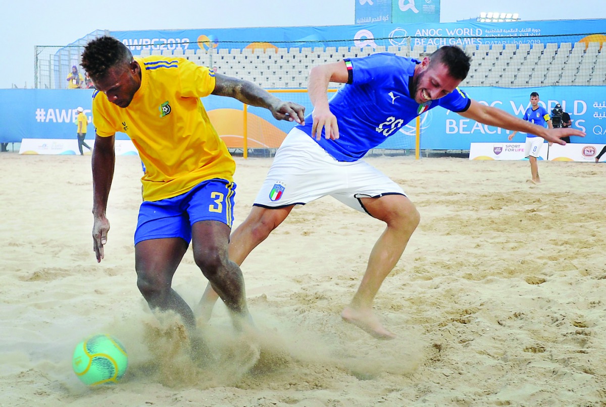 Italian and Solomon Islands players in action during their Beach Soccer match played at Katara Beach. 
Pic:Salim Matramkot/ The Peninsula