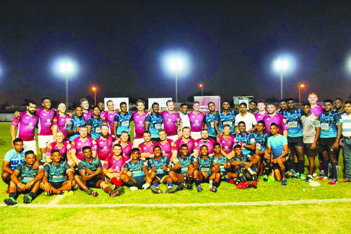DRFC and SLAF team players and officials posing for a photograph after their friendly rugby encounter which took place at the Doha Rugby Football Centre. 