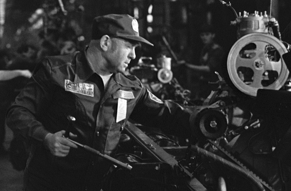 Soviet cosmonaut Alexei Leonov works at the main assembly department of the ZiL (