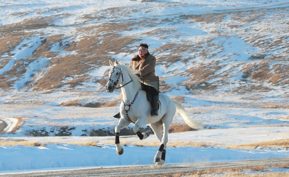 This undated picture released by Korean Central News Agency on October 16, 2019 shows North Korean leader kim Jong Un riding a white horse amongst the first snow at Mouth Paektu. - South Korea / AFP