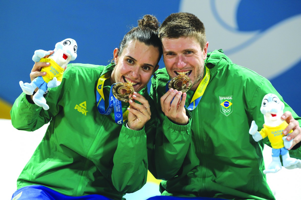 Brazil’s Andre Baran and Rafaella Miller celebrate with their gold medals. (Laurel Photo Services) 