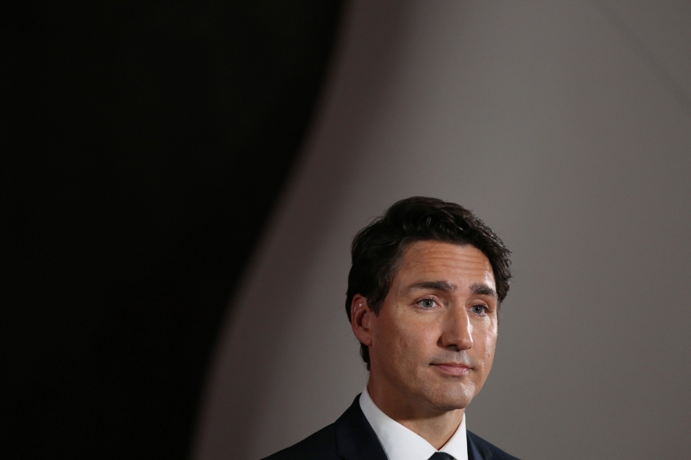 In this file photo taken on October 7, 2019 Canadian Prime Minister and Liberal Party leader Justin Trudeau listens to questions during a press conference after the Federal Leaders Debate at the Canadian Museum of History in Gatineau, Quebec. / AFP / Dave