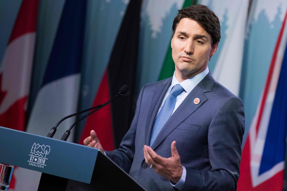 Canadian Prime Minister Justin Trudeau addresses a press conference at the conclusion of the G7 summit in La Malbaie Quebec on June 9 2018 AFP Lars Hagberg