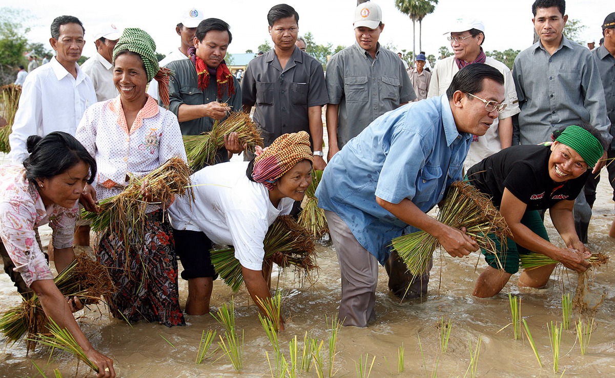 Hun Sen planting rice in 2008. He styles himself as a humble leader of a party representing ordinary Cambodians. Reuters