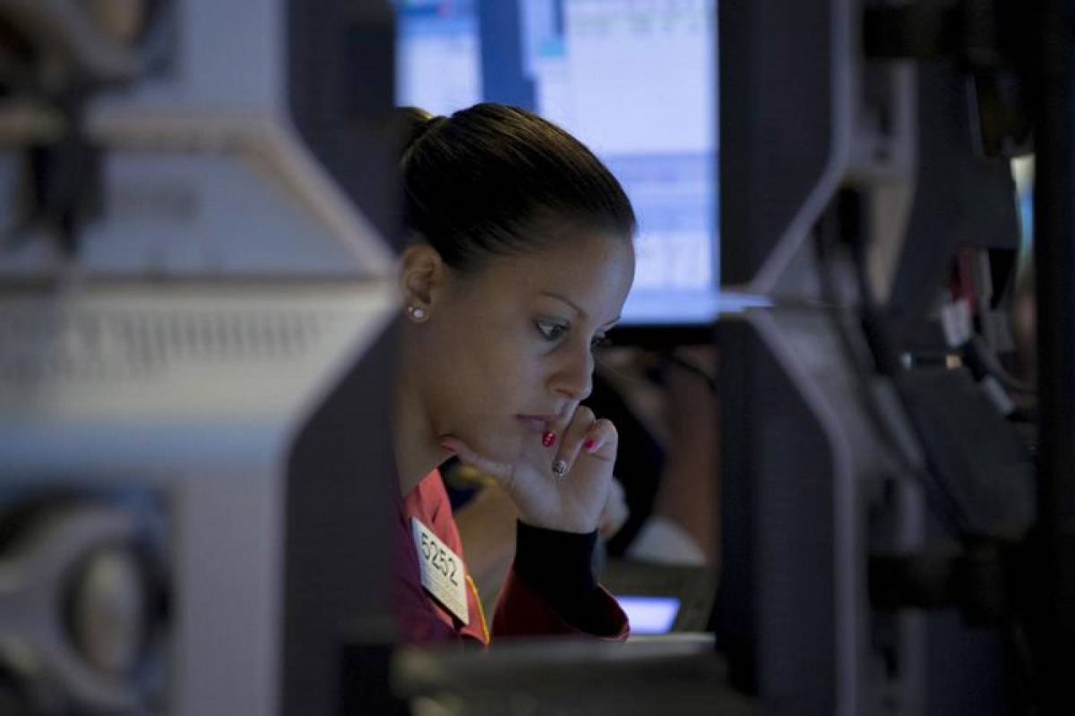 A trader works inside a booth on the floor of the New York Stock Exchange September 15, 2015. Reuters/Brendan McDermid