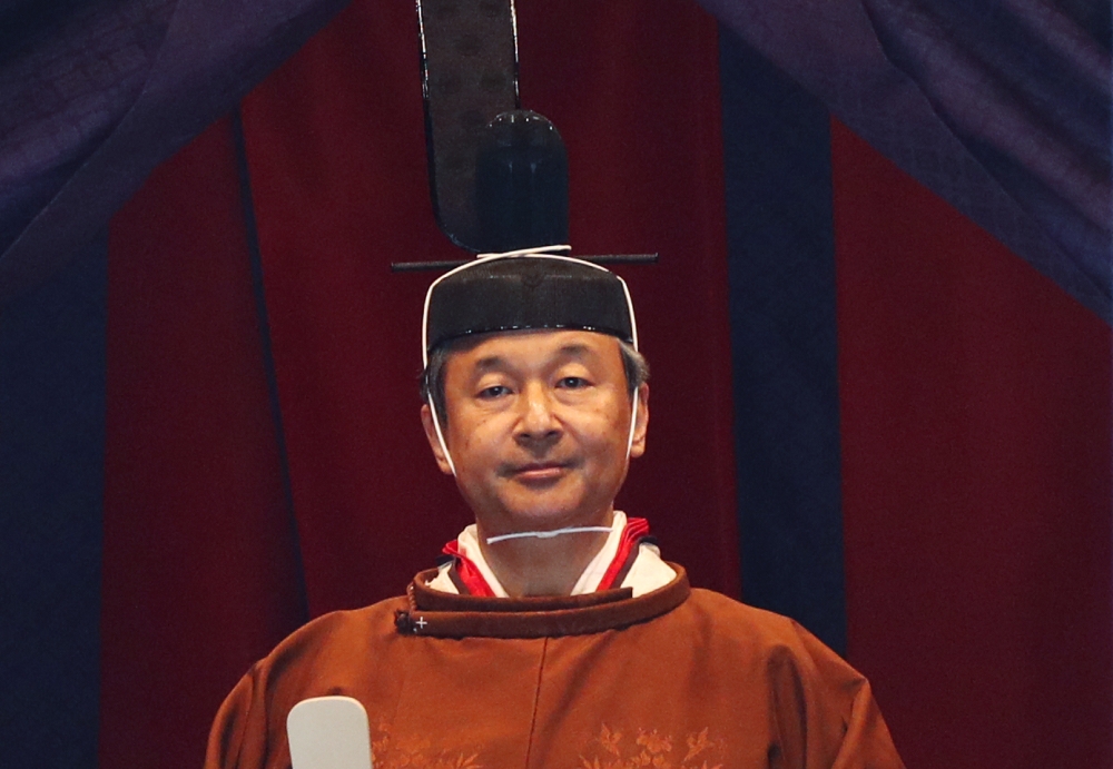 Emperor Naruhito officially proclaims his ascension to the Chrysanthemum Throne during an enthronement ceremony at the Imperial Palace in Tokyo on October 22, 2019. / AFP / POOL / ISSEI KATO AND Issei KATO 