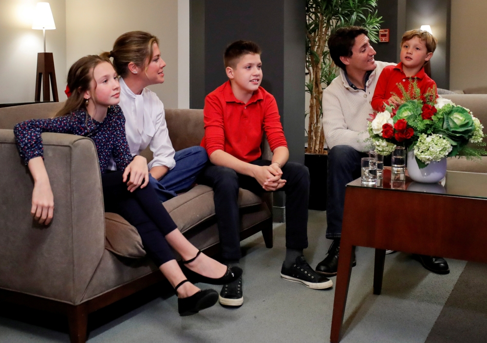 Liberal leader and Canadian Prime Minister Justin Trudeau and his wife Sophie Gregoire Trudeau, sons Xavier and Hadrien, and daughter Ella-Grace watch a television broadcast of the initial results from the federal election, in Montreal, Canada, October 21