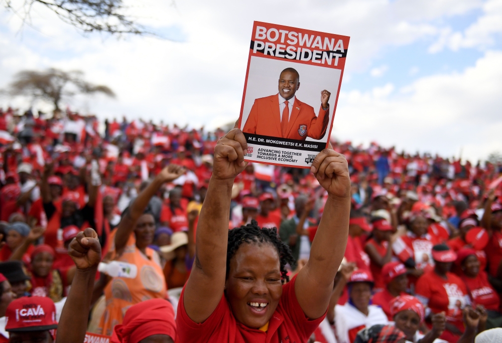  Botswana Democratic Party (BDP) supporter holds up a poster during an election campaign rally in Mokgweetsi Masisi's, President of Botswana and leader of the BDP, home village in Moshupa, on October 22, 2019. AFP / Monirul Bhuiyan 