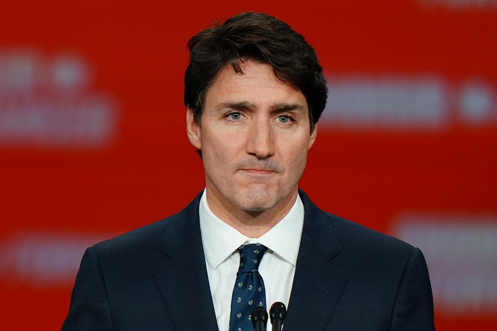 Liberal leader and Canadian Prime Minister Justin Trudeau stands on stage after the federal election at the Palais des Congres in Montreal, Quebec, Canada October 22, 2019. REUTERS/Carlo Allegri