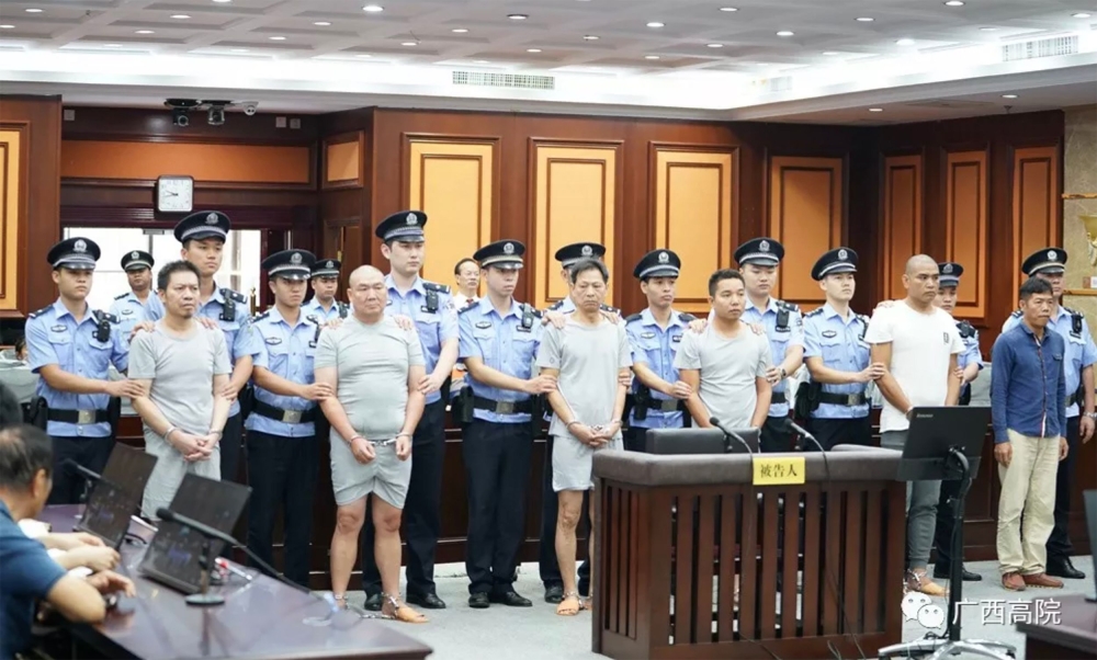 This handout photograph taken on October 17, 2019 and released on October 23 by the Nanning Intermediate People's Court, shows six men convicted of attempted murder charges during their sentencing at the Nanning Intermediate People's Court, in China's sou