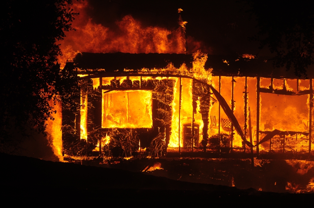 Flames and smoke rise after a fire broke out at Geyserville town in Sonoma County, California, United States on October 25, 2019. Authorities have ordered residents of a small town in the state of California's wine country to evacuate as strong winds fuel