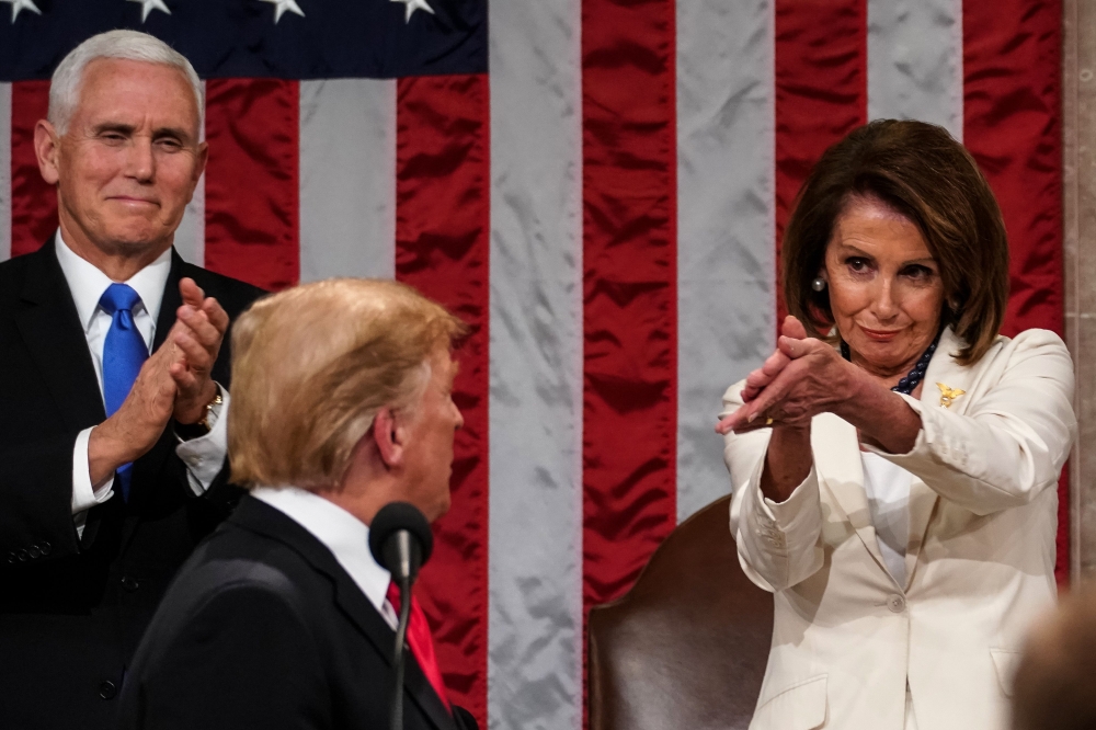 Donald Trump arrives to deliver the State of the Union address alongside Speaker of the House Nancy Pelosi and Vice President Mike Pence at the US Capitol on February 5, 2019. AFP / Doug Mills  