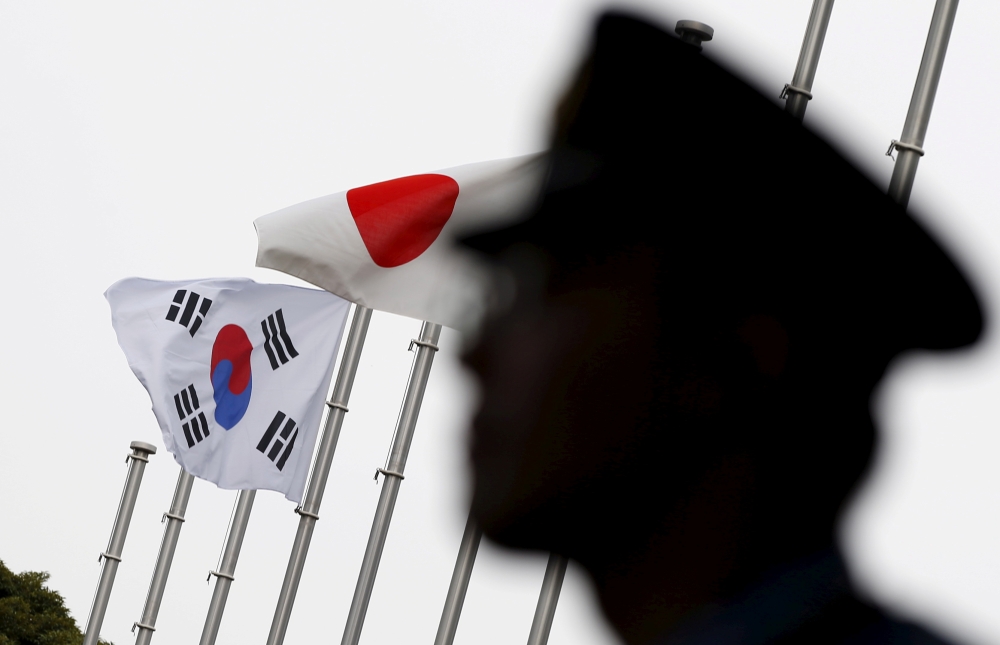 Japan and South Korea national flags at a hotel where South Korean embassy in Tokyo Japan is holding reception to mark the 50th anniversary of normalisation of ties, June 22, 2015. Reuters / Toru Hanai