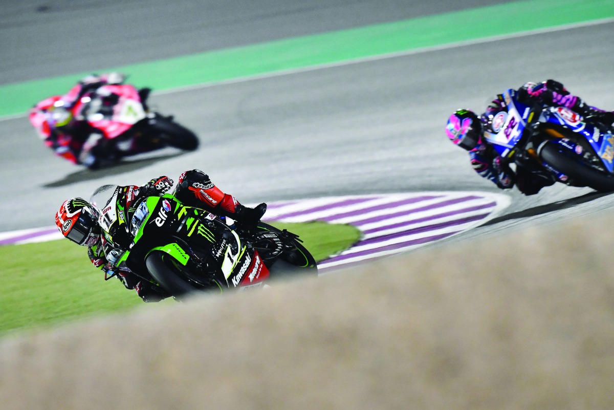 Great Britain’s Jonathan Rea of Kawasaki Racing Team WorldSBK (left) storms ahead in Race 1 of the WorldSBK final round at the Losail International Circuit, yesterday.