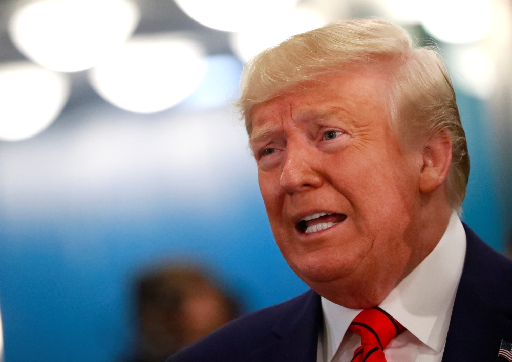 FILE PHOTO: U.S. President Donald Trump speaks to reporters as he arrives for the 74th session of the United Nations General Assembly at U.N. headquarters in New York City, New York, U.S., September 24, 2019. REUTERS/Yana Paskova/File Photo