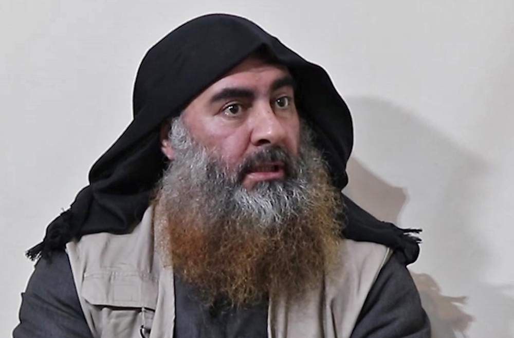 In this file photo taken on April 30, 2019 In this undated tv grab taken from a video released by Al-Furqan media, the chief of the Islamic State group Abu Bakr al-Baghdadi purportedly appears for the first time in five years in a propaganda video in an u