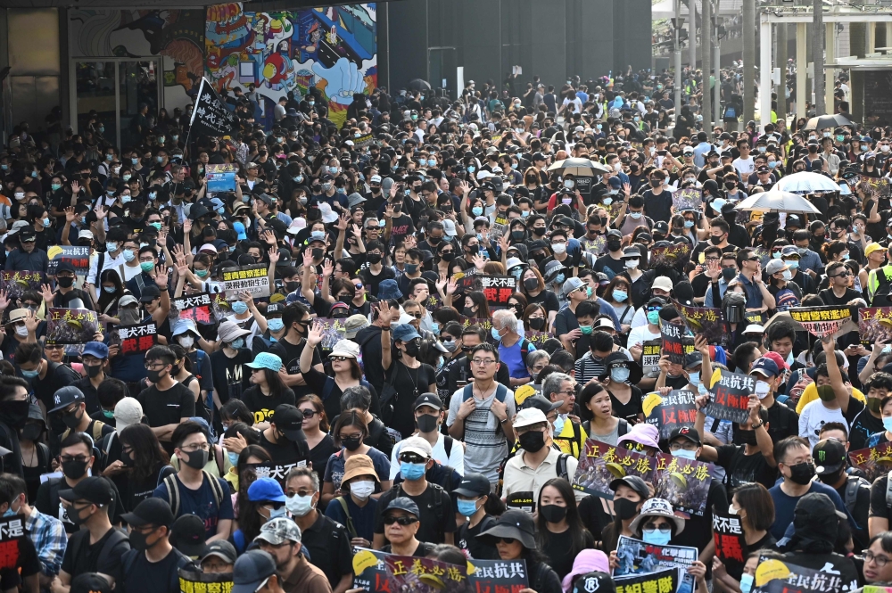 Pro-democracy protesters attend a rally in the Tsim Sha Tsui district in Hong Kong on October 27, 2019.  AFP / Philip FONG