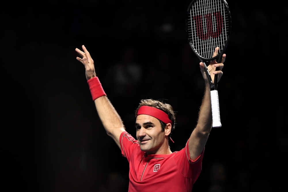 Swiss Roger Federer celebrates his victory during the final match at the Swiss Indoors tennis tournament in Basel on October 27, 2019. / AFP / FABRICE COFFRINI