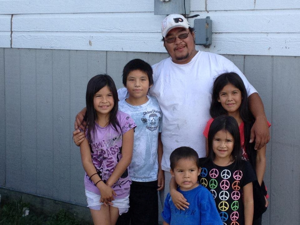 Tyson McKay, of the northern Manitoba indigenous community of Cross Lake, poses with his nieces and nephews in the fall of 2014.  Kelvin McKay via Reuters. 