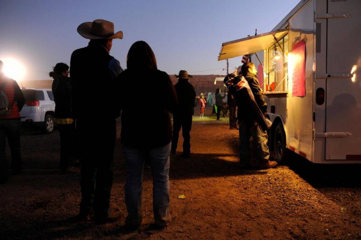 People wait for food from a mobile vendor at the Utah Navajo Fair in Bluff, Utah, US, October 28, 2017. Reuters/Andrew Cullen