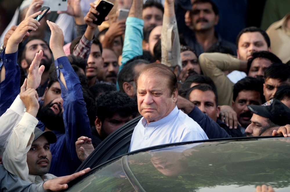 FILE PHOTO: Former Prime Minister Nawaz Sharif, who was temporarily released from prison, arrives to attend funeral services for his wife, Kulsoom, in Lahore, Pakistan September 14, 2018. REUTERS/Mohsin Raza/File Photo