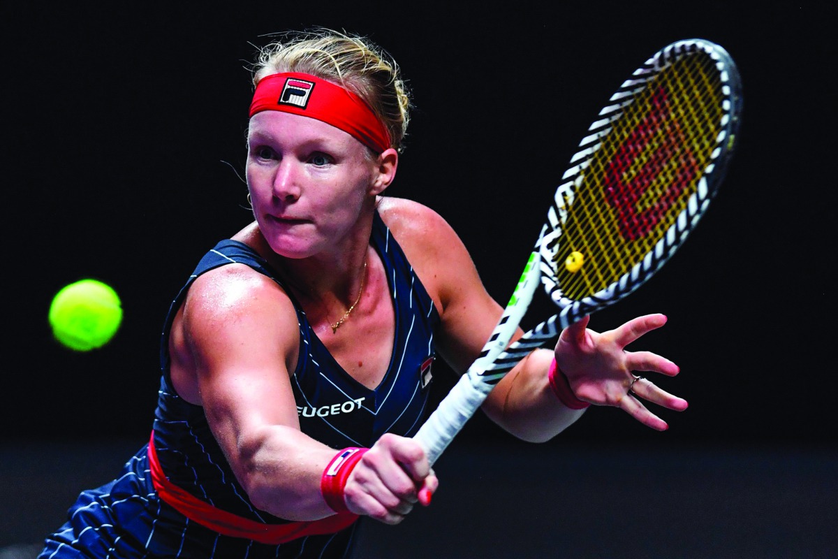 Kiki Bertens of Netherlands hits a return against Ashleigh Barty of Australia during their women's singles match in the WTA Finals tennis tournament in Shenzhen on October 29, 2019. AFP / Noel Celis
