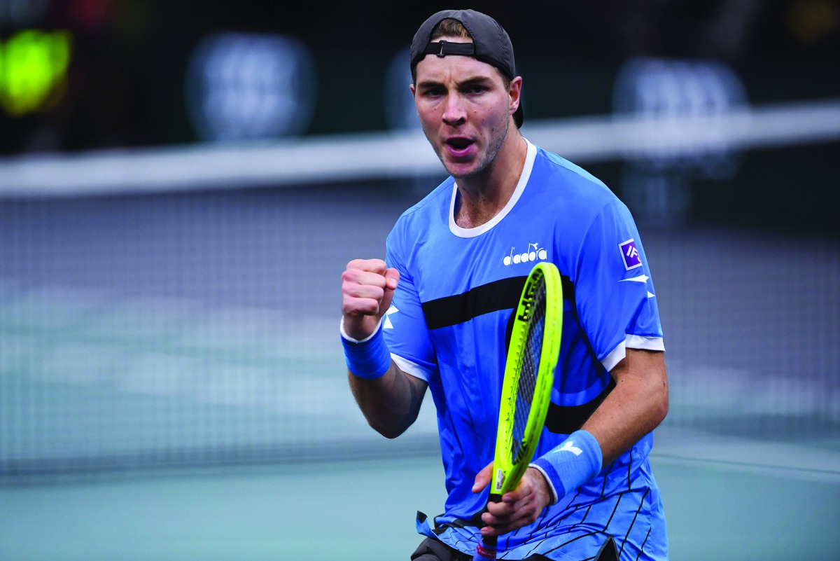 Germany's Jan-Lennard Struff celebrates after winning against Russia's Karen Khachanov during their men's singles tennis match on day two of the ATP World Tour Masters 1000 - Rolex Paris Masters - indoor tennis tournament at The AccorHotels Arena in Paris