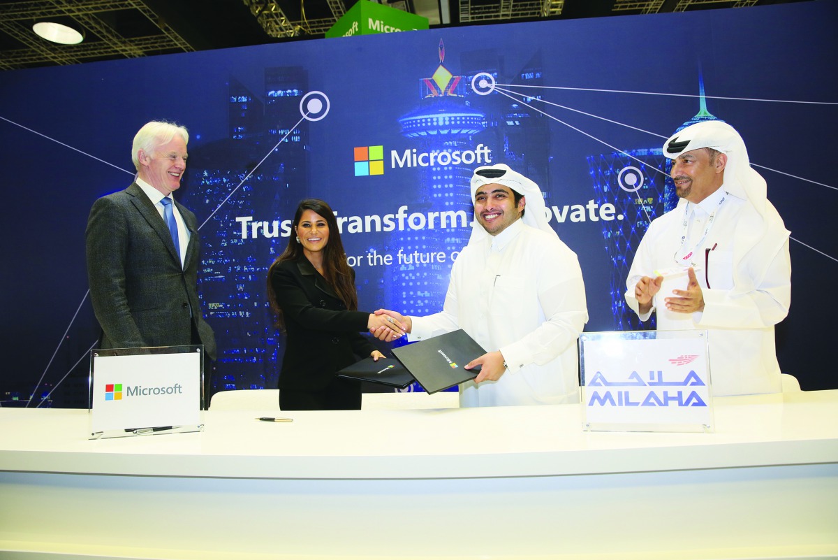 Abdulrahman Essa Al Mannai (second right), Milaha`s President & CEO and Lana Khalaf (second left), Country Manager, Microsoft Qatar during the signing ceremony.