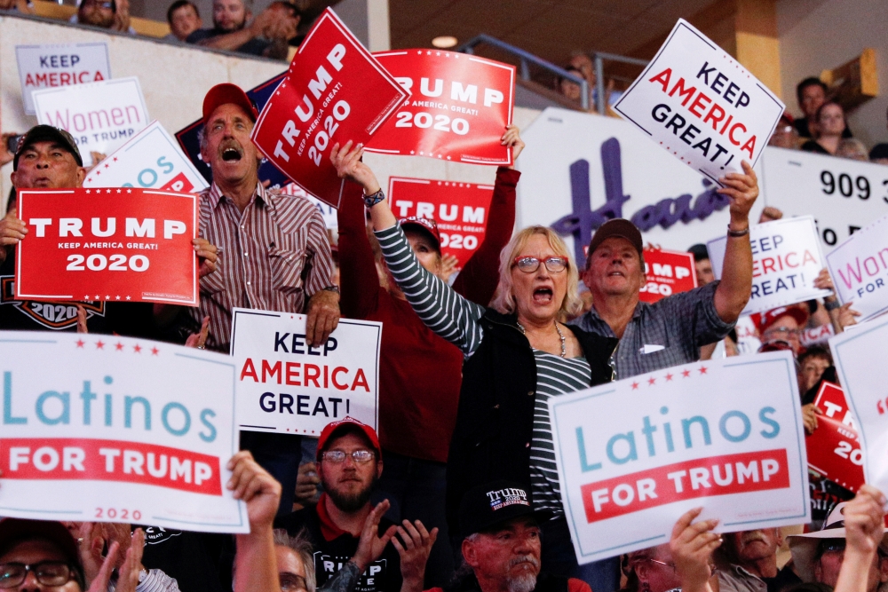 Members of the audience look on as Donald Trump delivers remarks at a Keep America Great rally at the Santa Ana Star Center in Rio Rancho, New Mexico, on September 16, 2019. Reuters/Tom Brenner
 
