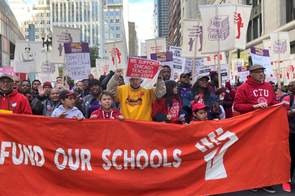 Teachers and supporters march, days before the teacher's union was set to go on strike if a contract settlement was not reached, in Chicago, Illinois, U.S. October 14, 2019. Reuters/Brendan O'Brien
 
 