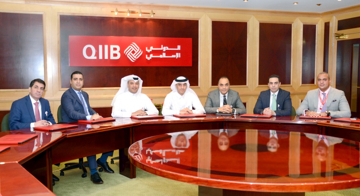 QIIB Deputy CEO Jamal Abdullah Al Jamal (centre) and other officials at the workshop held to discuss cyber-security related issues and challenges, yesterday. 