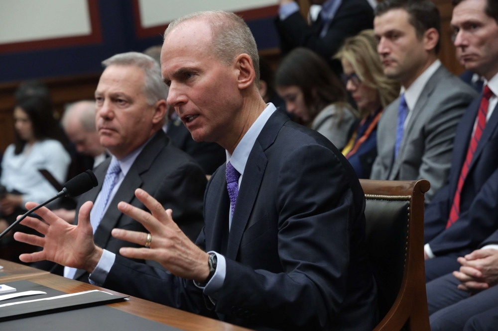 Dennis Muilenburg (R), president and CEO of the Boeing Company, and John Hamilton (L), vice president and chief engineer of Boeing Commercial Airplanes, testify before the House Transportation and Infrastructure Committee October 30, 2019, on Capitol Hill