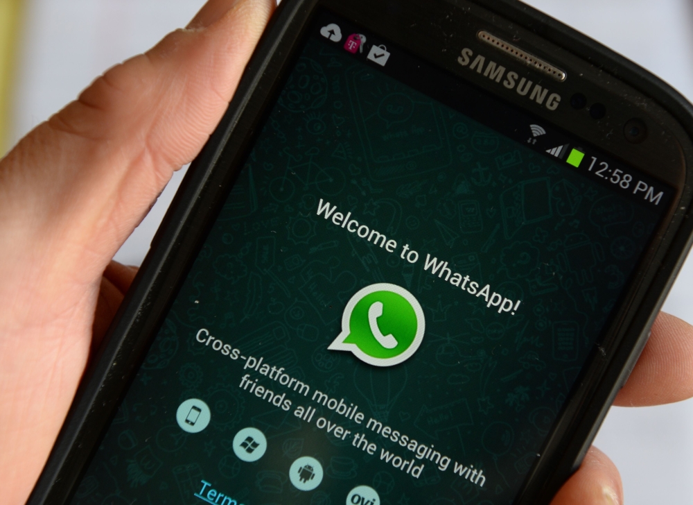 In this file photo taken on February 20, 2014 logo of WhatsApp, the popular messaging service bought by Facebook for USD $19 billion, is seen on a smartphonein New York. AFP / Stan Honda
 
