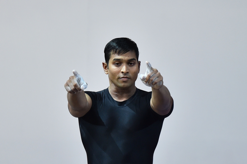 In this file photo taken on July 27, 2014 India's Ravi Kumar Katulu celebrates after a lift during the men's weightlifting 77kg class at the SECC Precinct during the 2014 Commonwealth Games in Glasgow.
