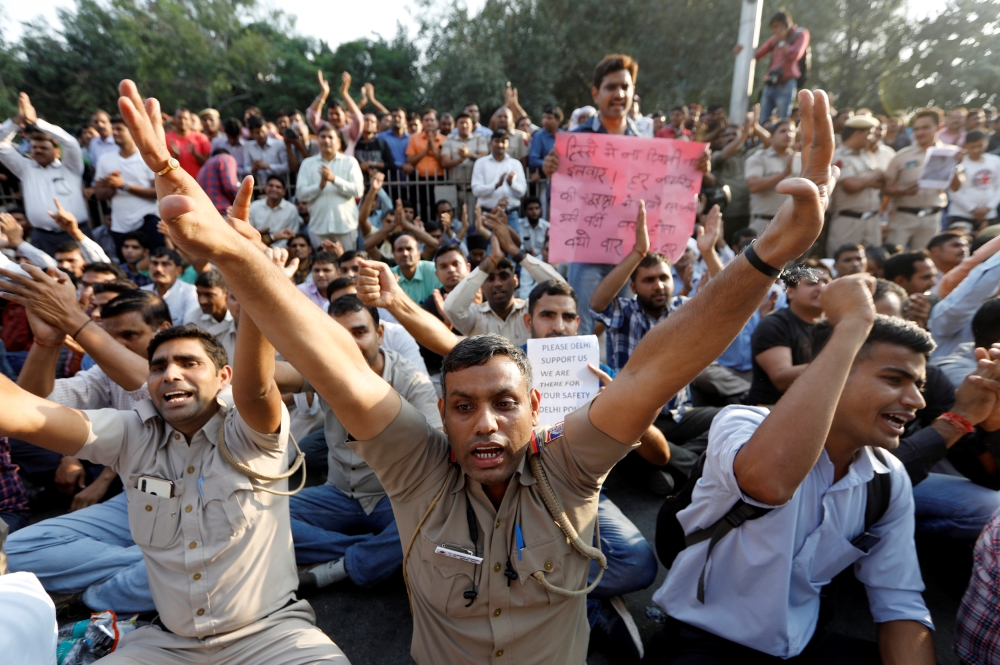 Delhi policemen shout slogans during a protest after clashes erupted between police and lawyers last week outside their headquarters in New Delhi, India, November 5, 2019. REUTERS/Adnan Abidi